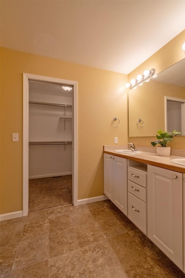 341 Northgate Loop, Helena, MT 59602 - bathroom featuring double vanity and a walk in closet