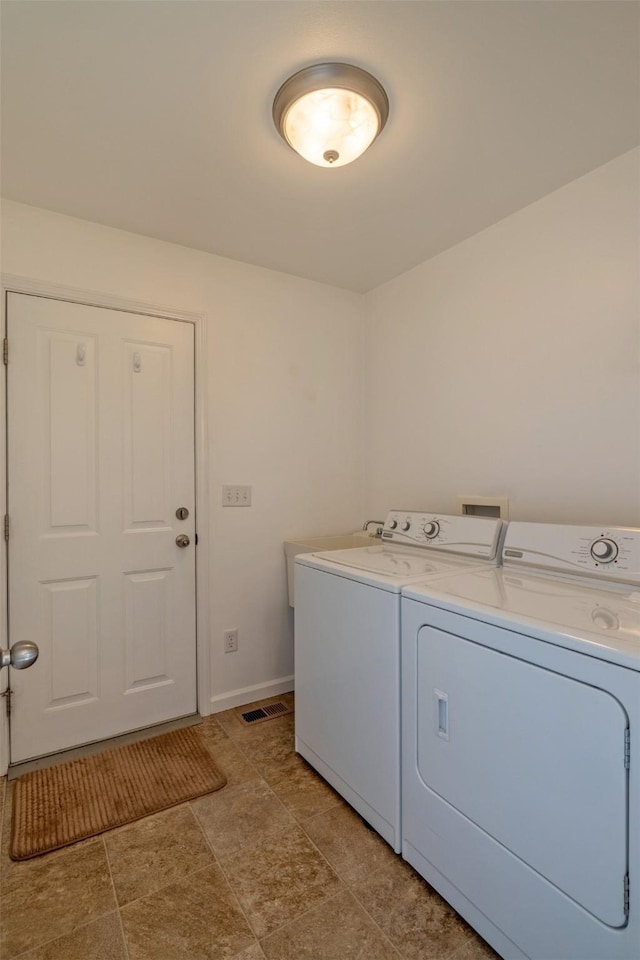 341 Northgate Loop, Helena, MT 59602 - laundry room featuring separate washer and dryer and baseboards