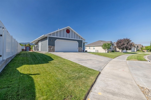 341 Northgate Loop, Helena, MT 59602 - view of front of property with stone siding, driveway, a garage, a residential view, and board and batten siding