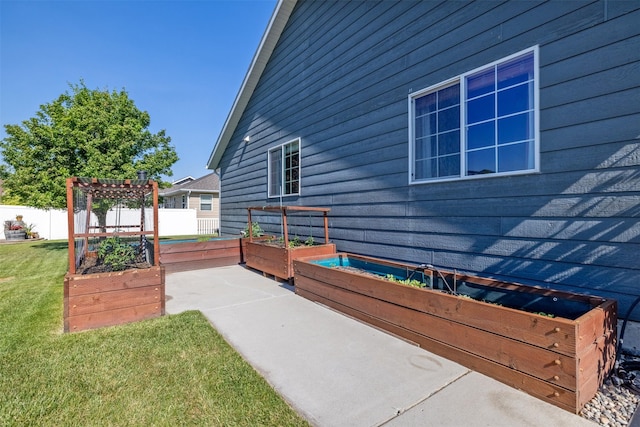 341 Northgate Loop, Helena, MT 59602 - view of patio / terrace with a garden