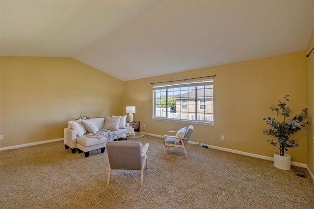 341 Northgate Loop, Helena, MT 59602 - carpeted living area featuring vaulted ceiling and baseboards