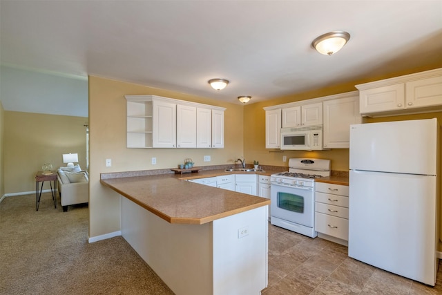 341 Northgate Loop, Helena, MT 59602 - kitchen with white appliances, a peninsula, white cabinetry, open shelves, and a breakfast bar area