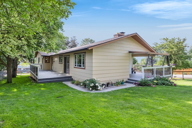 115 High Park Way, Missoula, MT 59803 - rear view of house with a wooden deck, a chimney, and a yard