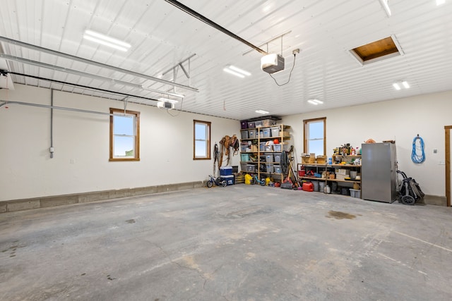 44 Kamloops Rd, Power, MT 59468 - garage featuring a garage door opener and a workshop area
