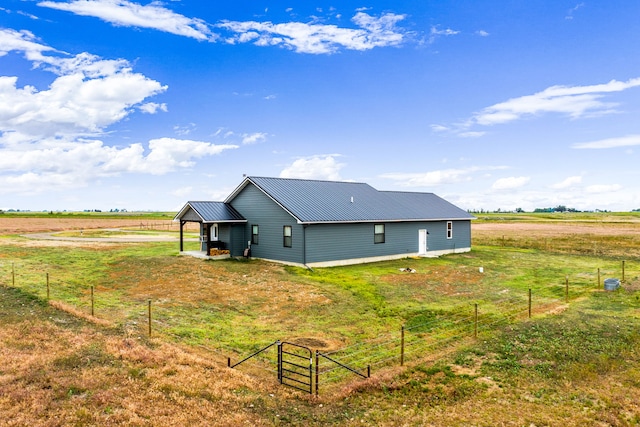 44 Kamloops Rd, Power, MT 59468 - view of side of property featuring a metal roof and a view of rural / pastoral area