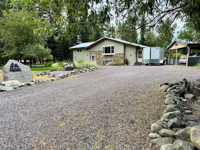676 Rawlings Rd, Libby, MT 59923 - view of front of house featuring driveway and entry steps