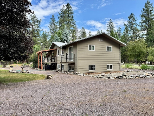 676 Rawlings Rd, Libby, MT 59923 - view of side of property featuring a balcony