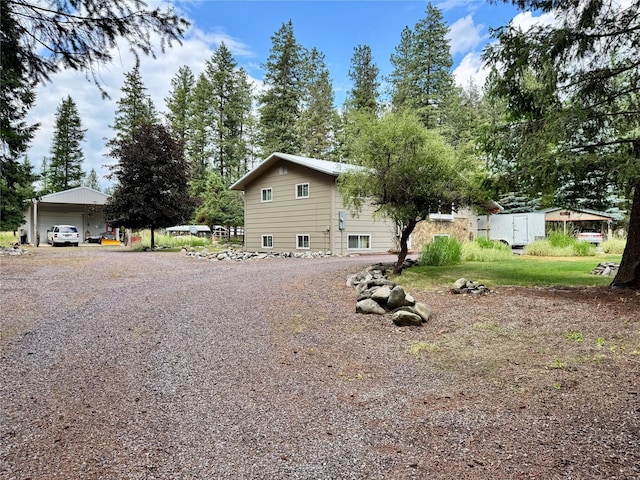 676 Rawlings Rd, Libby, MT 59923 - view of property exterior featuring a detached garage