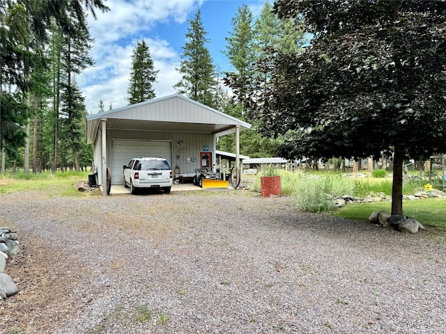 676 Rawlings Rd, Libby, MT 59923 - exterior space featuring a garage and an outbuilding