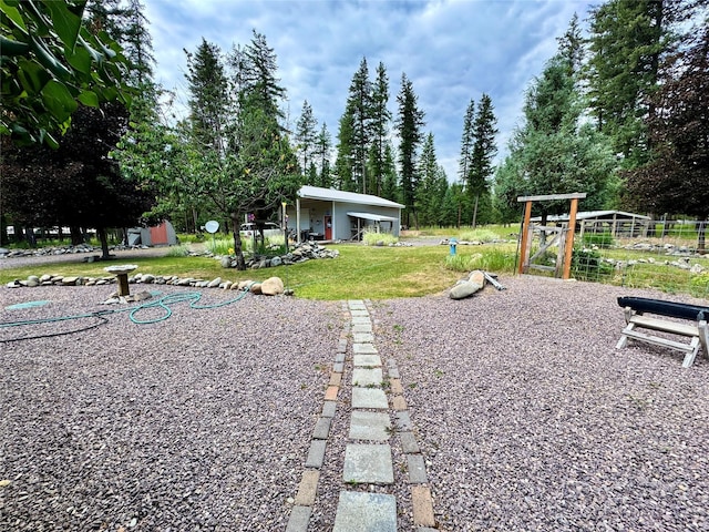 676 Rawlings Rd, Libby, MT 59923 - view of green lawn featuring an outdoor structure