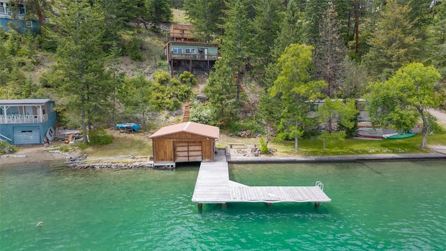 29276 White Swan Rd, Polson, MT 59860 - dock area featuring a water view and a wooded view