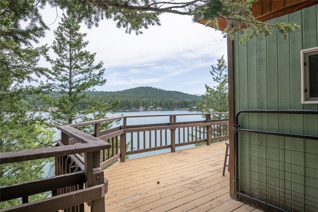 29276 White Swan Rd, Polson, MT 59860 - wooden terrace with a water view and a forest view