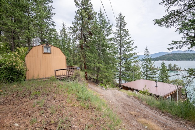 29276 White Swan Rd, Polson, MT 59860 - view of yard with a mountain view and an outdoor structure
