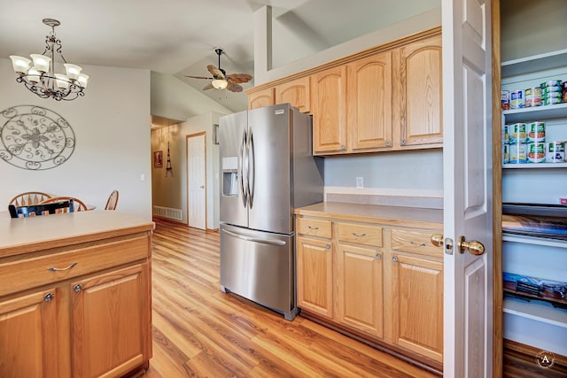 5835 Winter Wheat Dr, Helena, MT 59602 - kitchen featuring stainless steel fridge, light wood finished floors, ceiling fan, light countertops, and hanging light fixtures