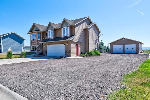5835 Winter Wheat Dr, Helena, MT 59602 - view of front of home with an outdoor structure, driveway, and a shingled roof