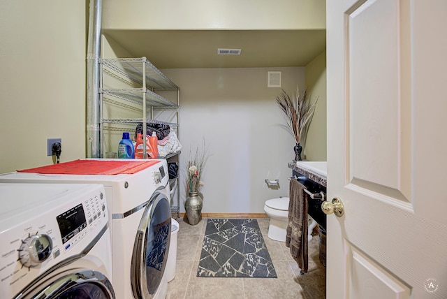 5835 Winter Wheat Dr, Helena, MT 59602 - washroom with washing machine and dryer and tile patterned floors
