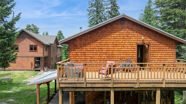220 Cliff Creek Rd, Whitefish, MT 59937 - back of property with a deck and a lawn