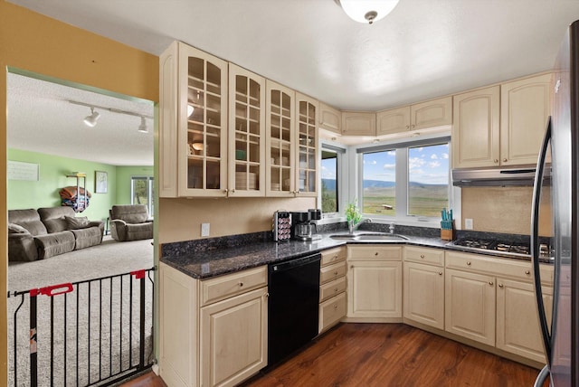 149 Meadow Vista Ln, Deer Lodge, MT 59722 - kitchen featuring stainless steel appliances, cream cabinetry, dark wood finished floors, glass insert cabinets, and under cabinet range hood