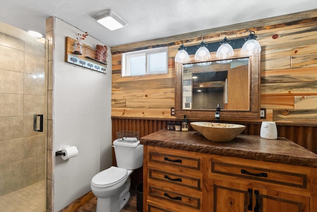 149 Meadow Vista Ln, Deer Lodge, MT 59722 - bathroom with vanity, a shower stall, and wood walls