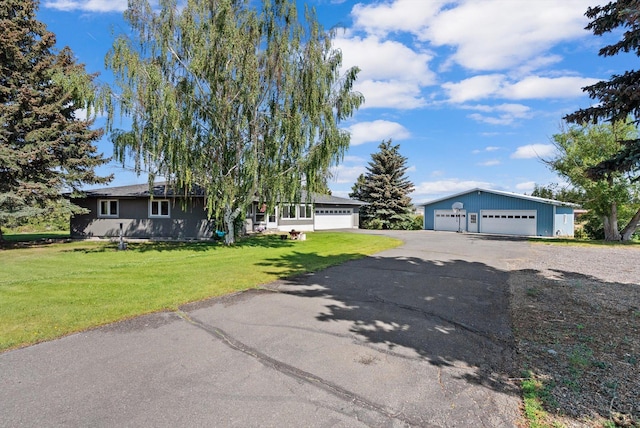 149 Meadow Vista Ln, Deer Lodge, MT 59722 - view of front of home featuring a detached garage and a front yard