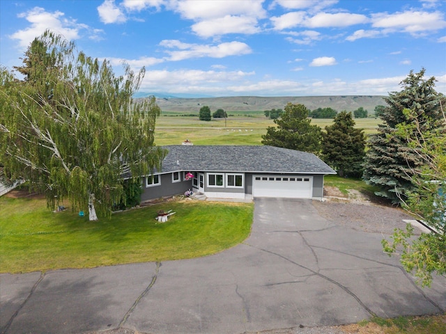 149 Meadow Vista Ln, Deer Lodge, MT 59722 - ranch-style home with asphalt driveway, an attached garage, and a front lawn