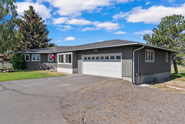 149 Meadow Vista Ln, Deer Lodge, MT 59722 - ranch-style house featuring driveway, a garage, a front lawn, and brick siding