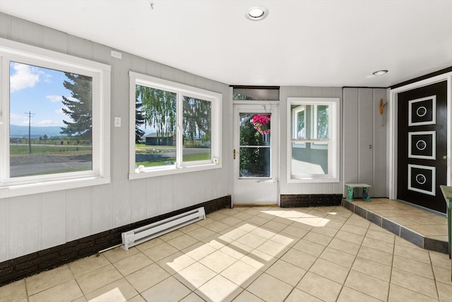 149 Meadow Vista Ln, Deer Lodge, MT 59722 - unfurnished sunroom with baseboard heating and healthy amount of natural light