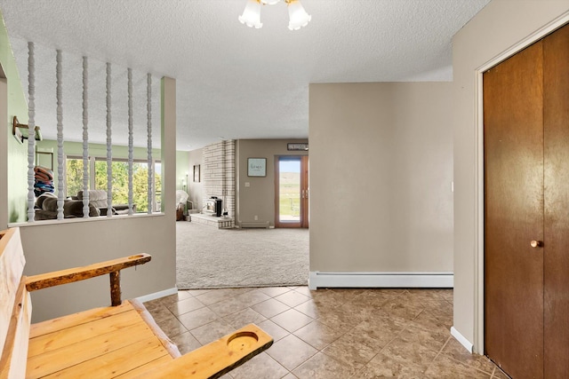 149 Meadow Vista Ln, Deer Lodge, MT 59722 - hall featuring tile patterned flooring, a textured ceiling, carpet flooring, and a baseboard radiator