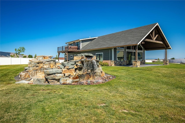 60951 Sparky Dr, Saint Ignatius, MT 59865 - back of house with roof with shingles and stone siding