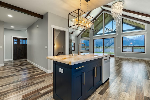 60951 Sparky Dr, Saint Ignatius, MT 59865 - kitchen featuring beam ceiling, blue cabinetry, wood finished floors, light countertops, and a chandelier