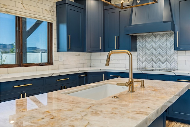60951 Sparky Dr, Saint Ignatius, MT 59865 - kitchen with range hood and blue cabinetry