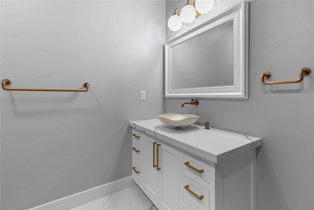60951 Sparky Dr, Saint Ignatius, MT 59865 - bathroom featuring vanity and marble look tile flooring