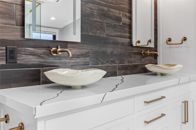 60951 Sparky Dr, Saint Ignatius, MT 59865 - bathroom with decorative backsplash and vanity