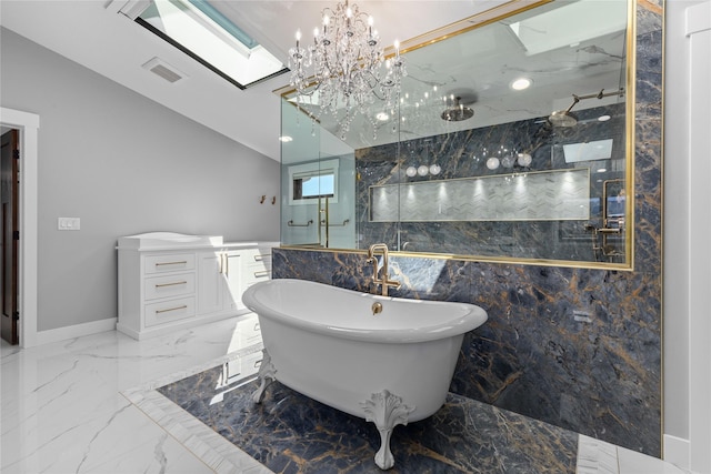 60951 Sparky Dr, Saint Ignatius, MT 59865 - full bath with marble tiled floors, a soaking tub, a marble finish shower, a skylight, and a chandelier