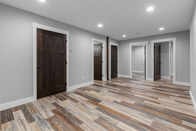 60951 Sparky Dr, Saint Ignatius, MT 59865 - unfurnished bedroom featuring recessed lighting, light wood-type flooring, and ensuite bathroom