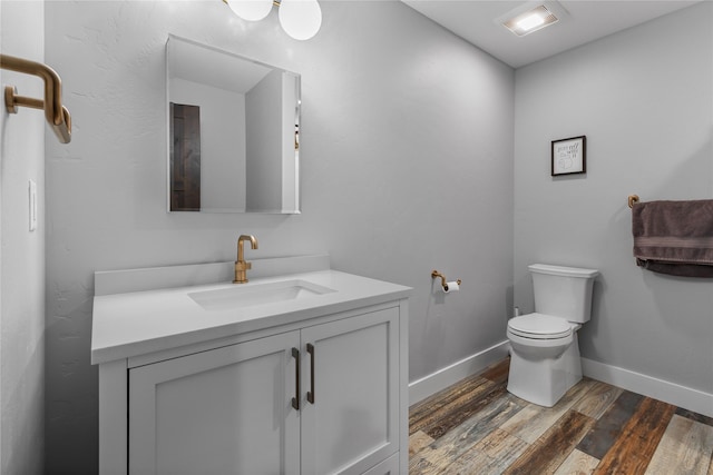 60951 Sparky Dr, Saint Ignatius, MT 59865 - half bath with vanity and wood finished floors