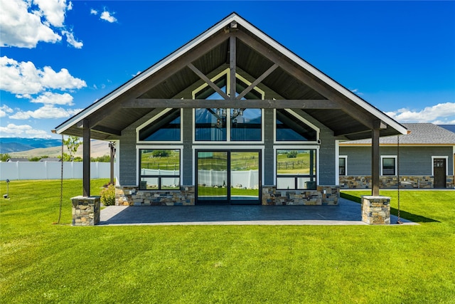 60951 Sparky Dr, Saint Ignatius, MT 59865 - back of house with a patio and stone siding