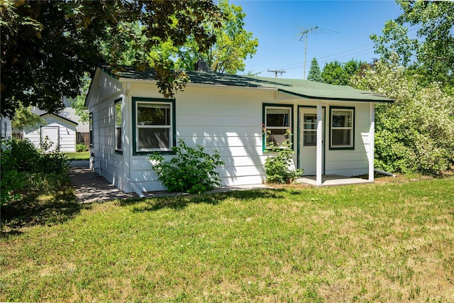 432 Willow Creek Rd, Corvallis, MT 59828 - view of front of home with a front lawn and a storage unit