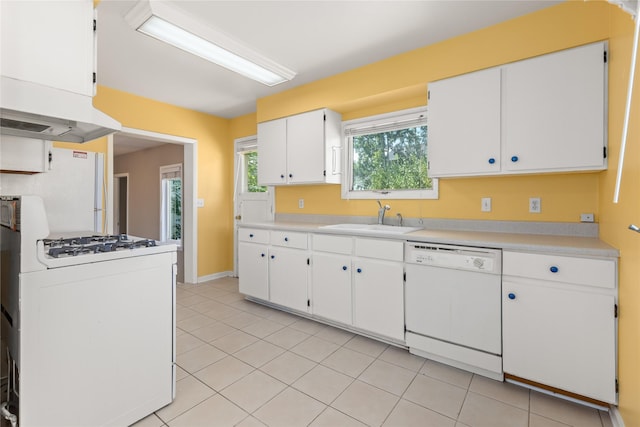 432 Willow Creek Rd, Corvallis, MT 59828 - kitchen with white appliances, light countertops, light tile patterned floors, and white cabinetry