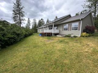 41052 Canyon View Dr, Polson, MT 59860 - back of property featuring a lawn