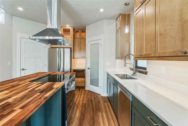 37 S Rodney St, Helena, MT 59601 - kitchen with butcher block countertops, island range hood, appliances with stainless steel finishes, dark wood-style flooring, and hanging light fixtures