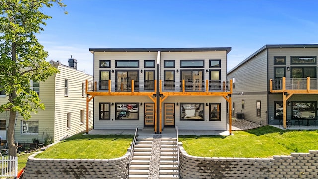 37 S Rodney St, Helena, MT 59601 - back of property with a balcony and a lawn