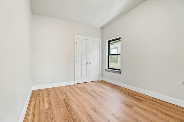 37 S Rodney St, Helena, MT 59601 - unfurnished bedroom featuring light wood-style floors and a closet