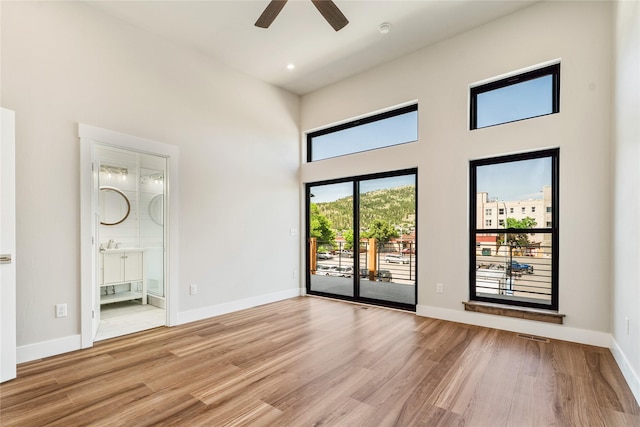 37 S Rodney St, Helena, MT 59601 - unfurnished room featuring light wood finished floors, ceiling fan, and a high ceiling