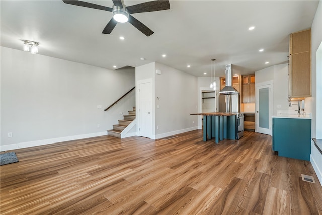 37 S Rodney St, Helena, MT 59601 - unfurnished living room featuring light wood-type flooring, stairway, a ceiling fan, and recessed lighting