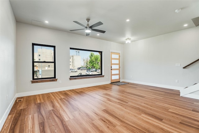 37 S Rodney St, Helena, MT 59601 - spare room with light wood-style flooring, ceiling fan, recessed lighting, and stairway