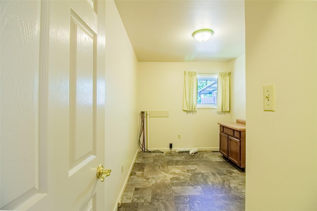 3455 N Hillcrest Dr, Butte, MT 59701 - laundry area featuring baseboards and stone finish floors