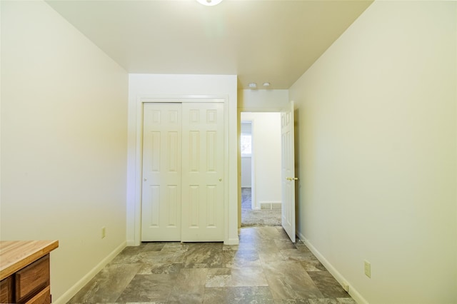 3455 N Hillcrest Dr, Butte, MT 59701 - unfurnished bedroom with a closet and stone finish flooring
