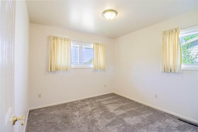 3455 N Hillcrest Dr, Butte, MT 59701 - spare room featuring carpet flooring and baseboards