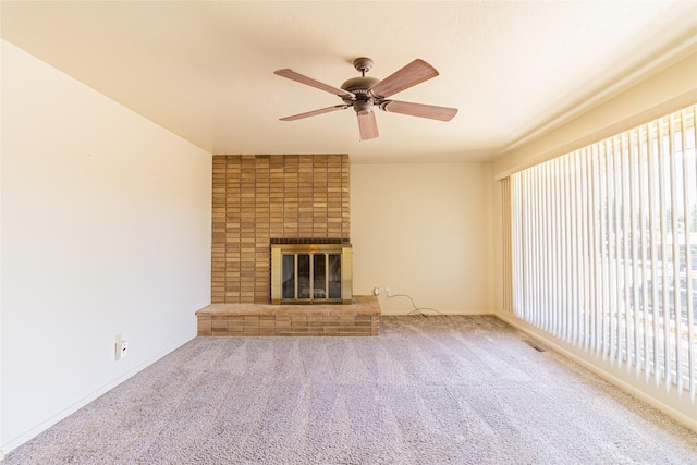 3455 N Hillcrest Dr, Butte, MT 59701 - unfurnished living room featuring a ceiling fan, a fireplace, and carpet flooring